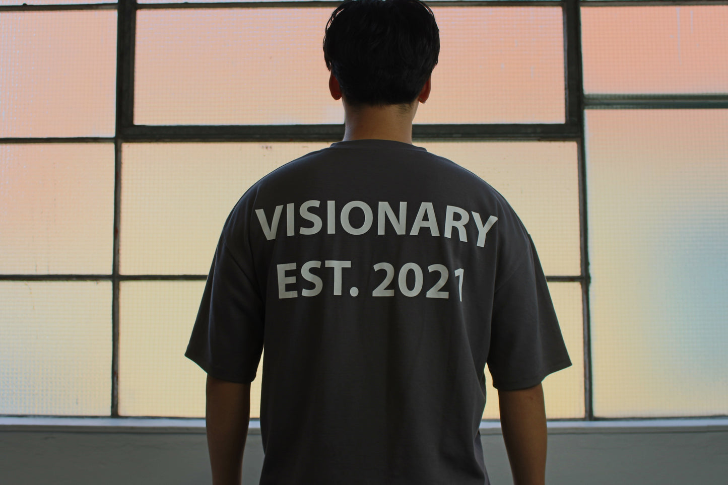 Product image showing the back of Vision studios spray paint logo tee (size M)